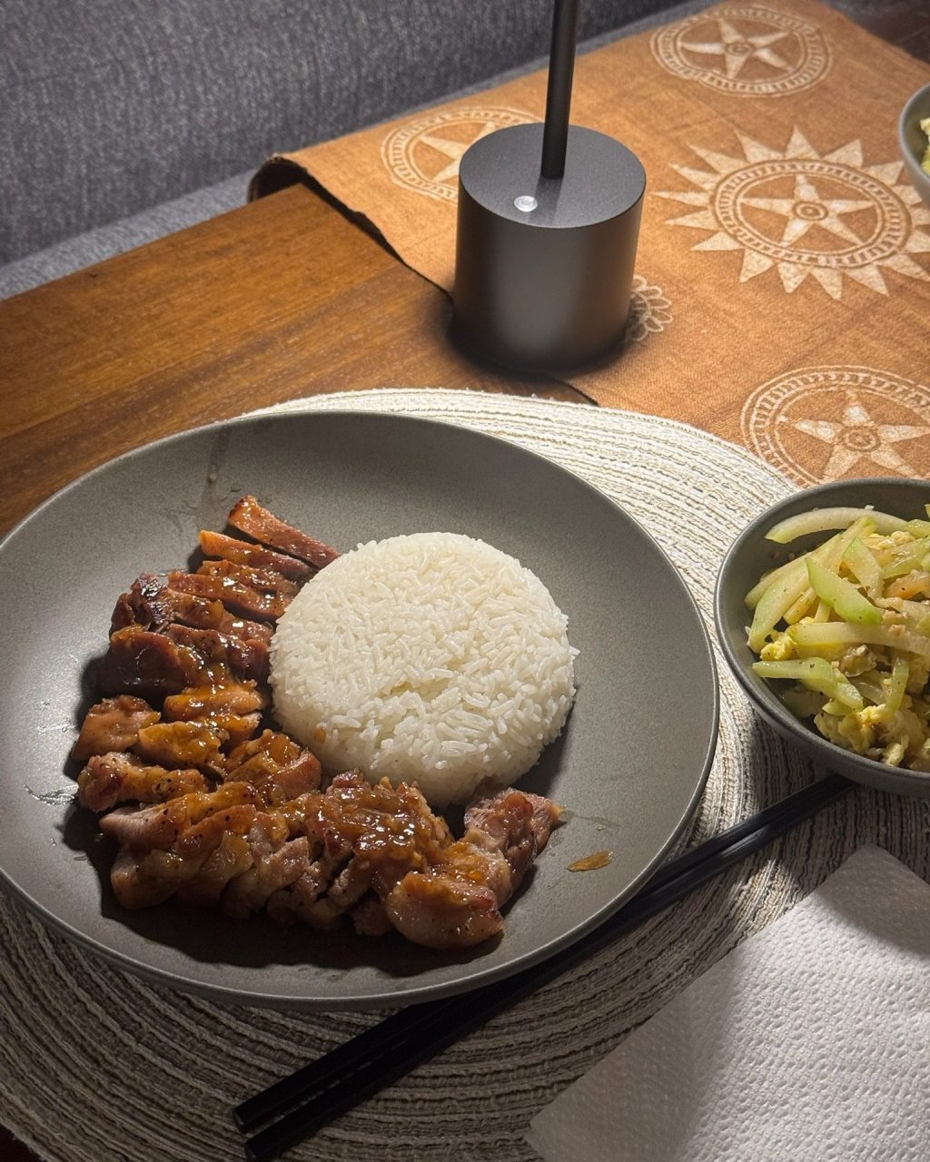 Sliced pork belly glazed in a sticky coconut braising sauce, served with a mound of white rice